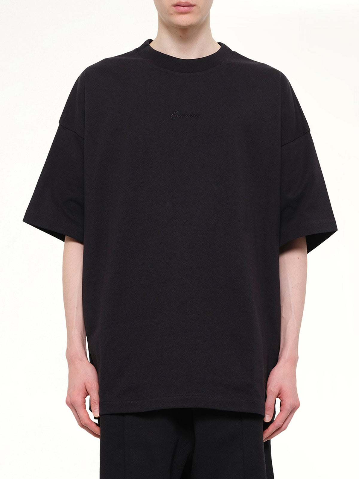 Image of T-Shirts. Product name - Signature 90's Short Sleeve T-Shirt in Black colour by brand - FEAR OF GOD ESSENTIALS