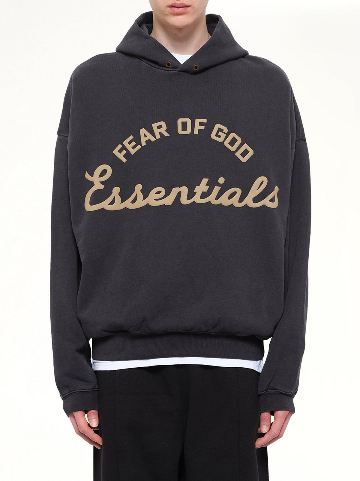 Image of a model wearing Outerwear. Product name - Training 90's Hoodie in Black colour by brand - FEAR OF GOD ESSENTIALS