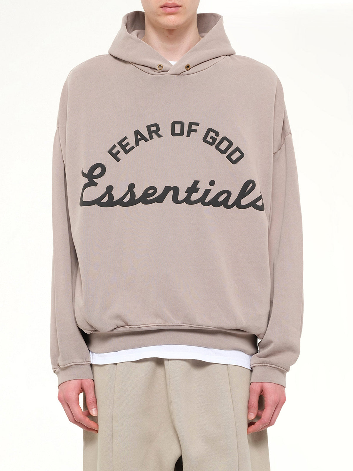 Image of a model wearing Outerwear. Product name - Training 90's Hoodie in Grey colour by brand - FEAR OF GOD ESSENTIALS