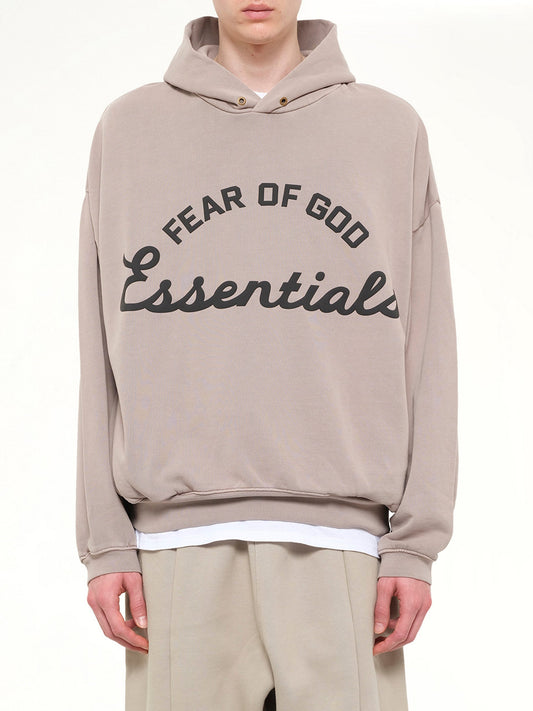 Image of a model wearing Outerwear. Product name - Training 90's Hoodie in Grey colour by brand - FEAR OF GOD ESSENTIALS