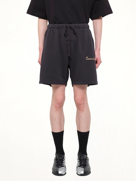 Image of a model wearing Shorts. Product name - Training Classic Fit Short in Black colour by brand - FEAR OF GOD ESSENTIALS