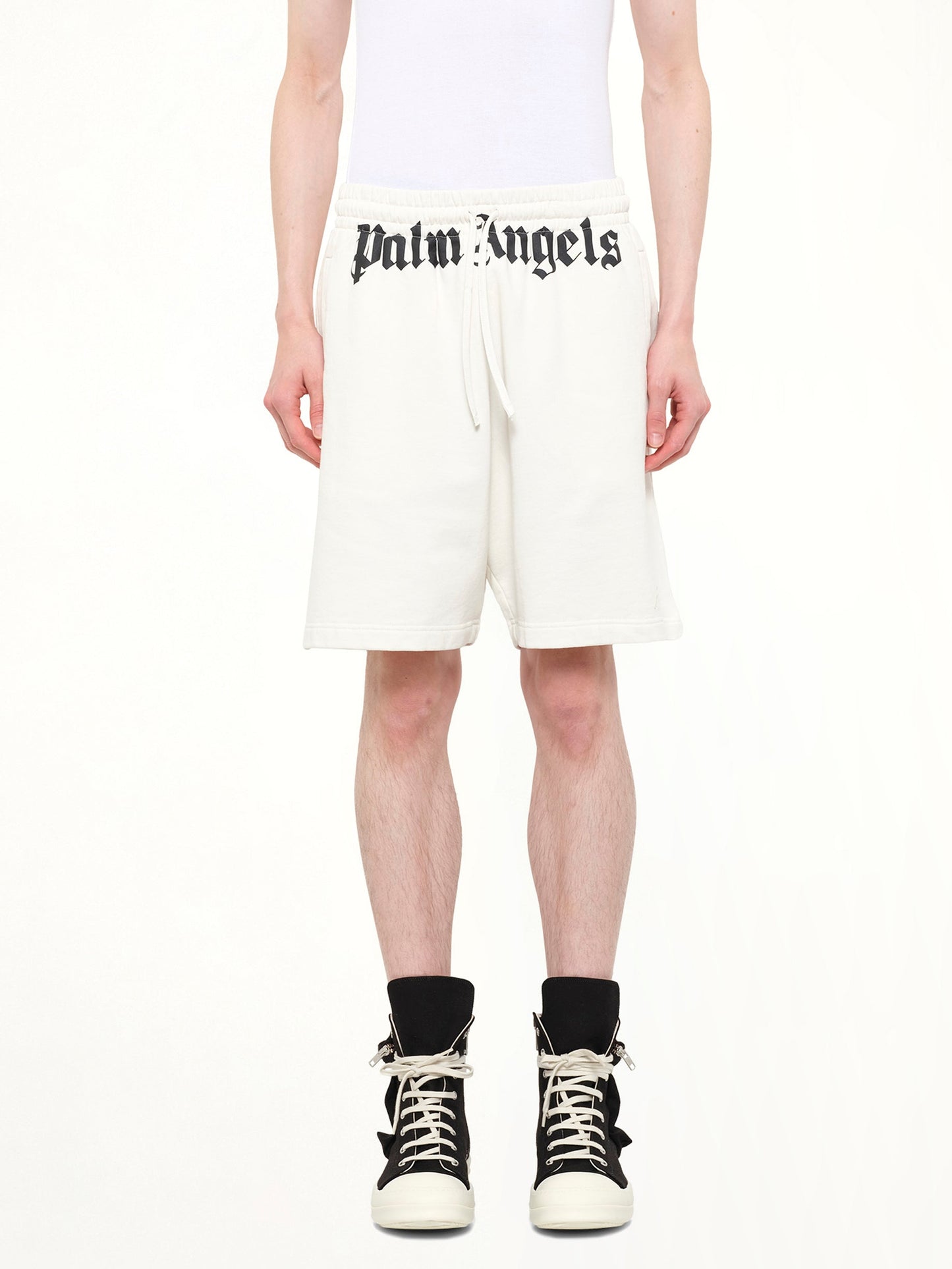 Image of a model wearing Shorts. Product name - Waist Logo Sweatshorts in White colour by brand - PALM ANGELS