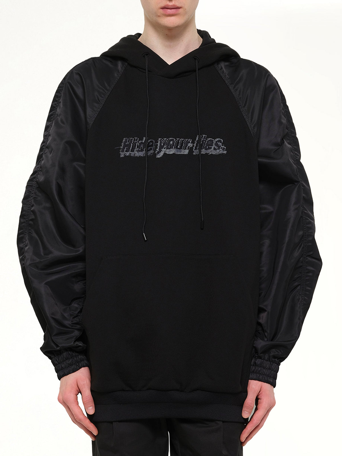 Image of a model wearing Outerwear. Product name - Juunj Hoodie in Black colour by brand - JUUNJ