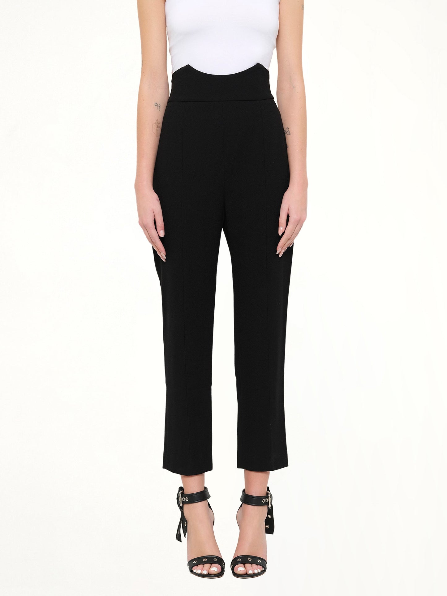 Image of a model wearing Pants. Product name - Alexander McQueen Pants in Black colour by brand - ALEXANDER MCQUEEN