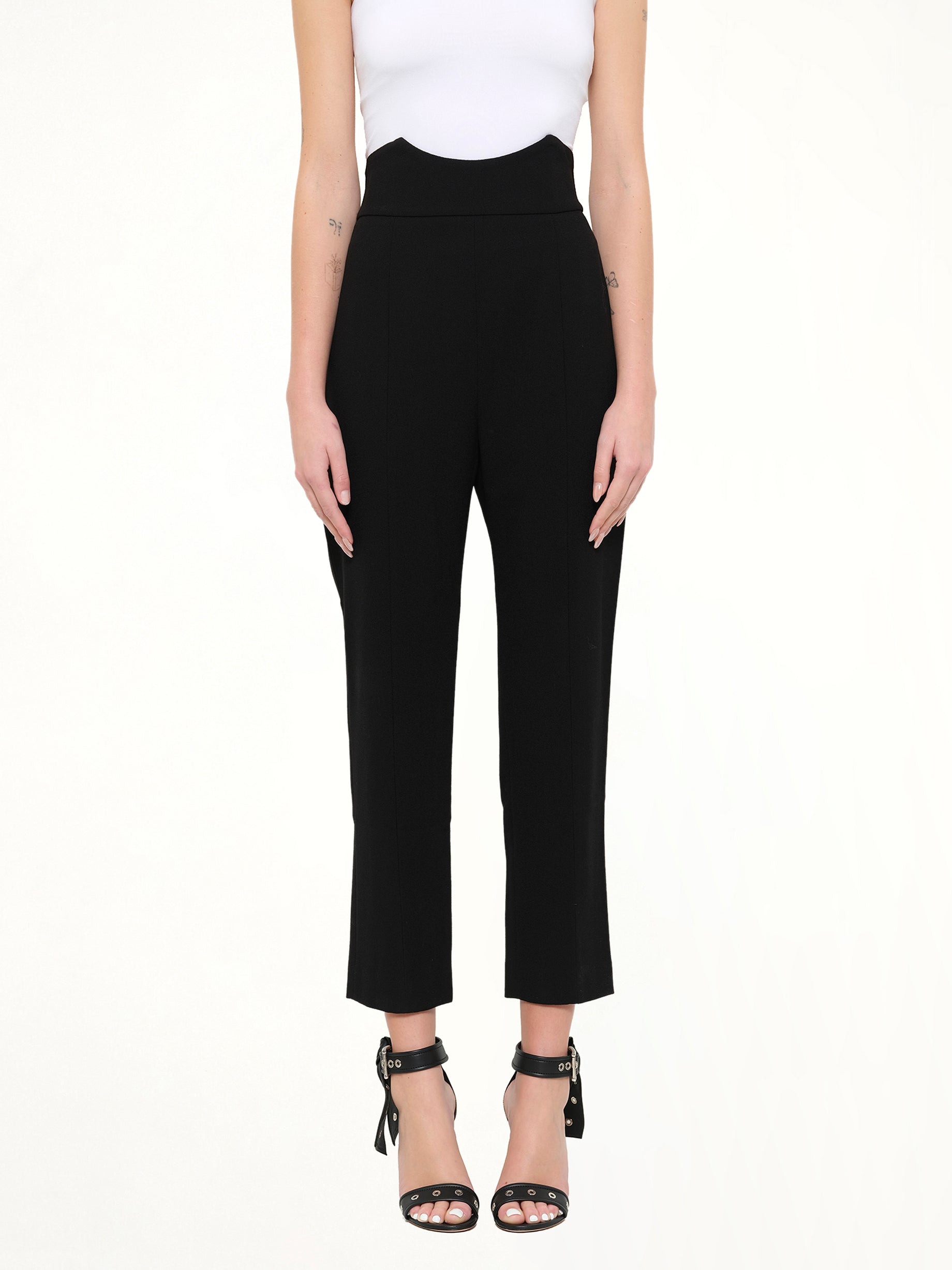 Image of a model wearing Pants. Product name - Alexander McQueen Pants in Black colour by brand - ALEXANDER MCQUEEN