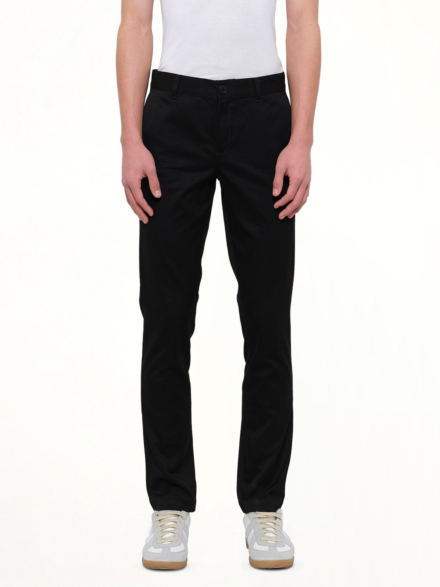 Image of a model wearing Pants. Product name - Chino Patch Pants in Black colour by brand - GIVENCHY