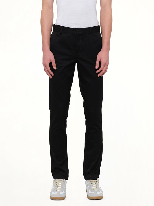 Image of a model wearing Pants. Product name - Chino Patch Pants in Black colour by brand - GIVENCHY