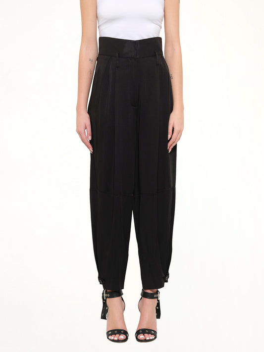 Image of a model wearing Pants. Product name - Crepe Envers Fit Pants in Black colour by brand - GIVENCHY
