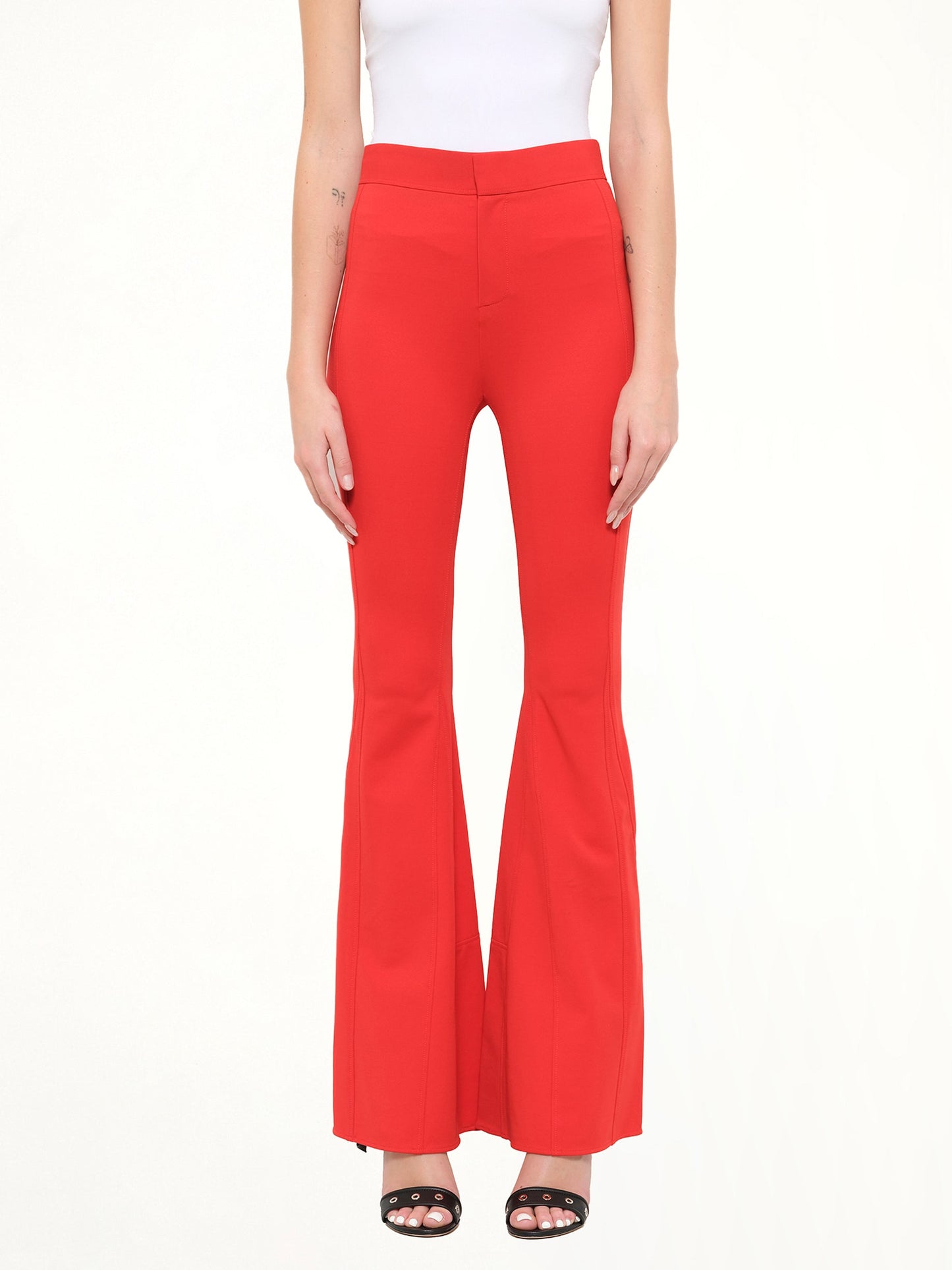 Image of a model wearing Pants. Product name - Givenchy Podium Trousers in Red colour by brand - GIVENCHY