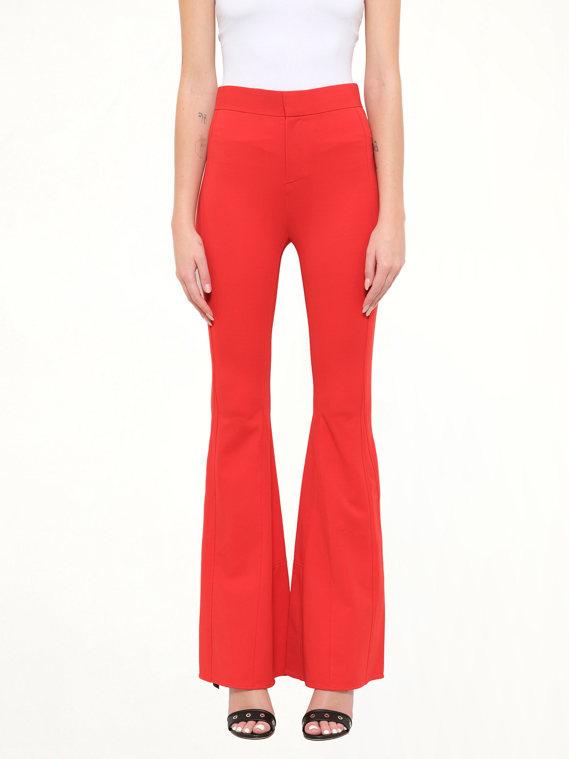Image of a model wearing Pants. Product name - Givenchy Podium Trousers in Red colour by brand - GIVENCHY