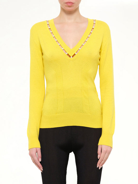 Image of a model wearing Outerwear. Product name - Lounges Sweater in Yellow colour by brand - GIVENCHY