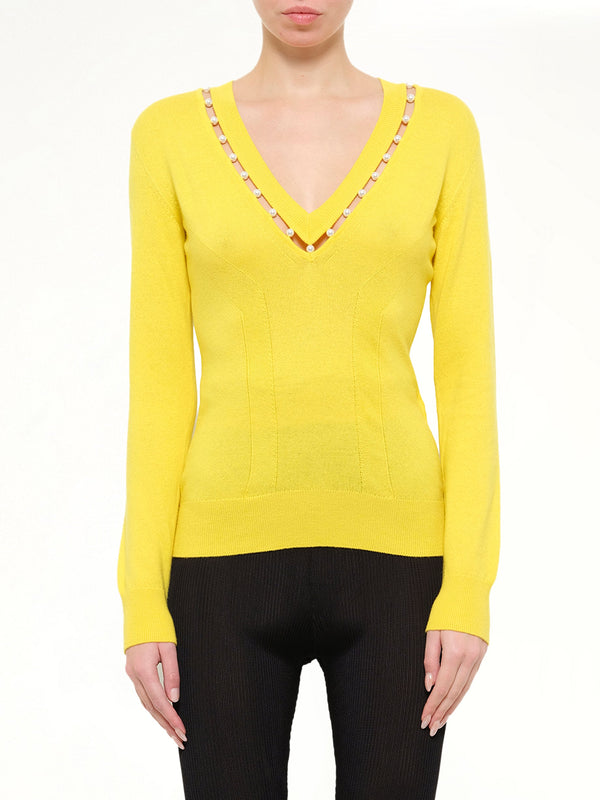 Image of a model wearing Outerwear. Product name - Lounges Sweater in Yellow colour by brand - GIVENCHY
