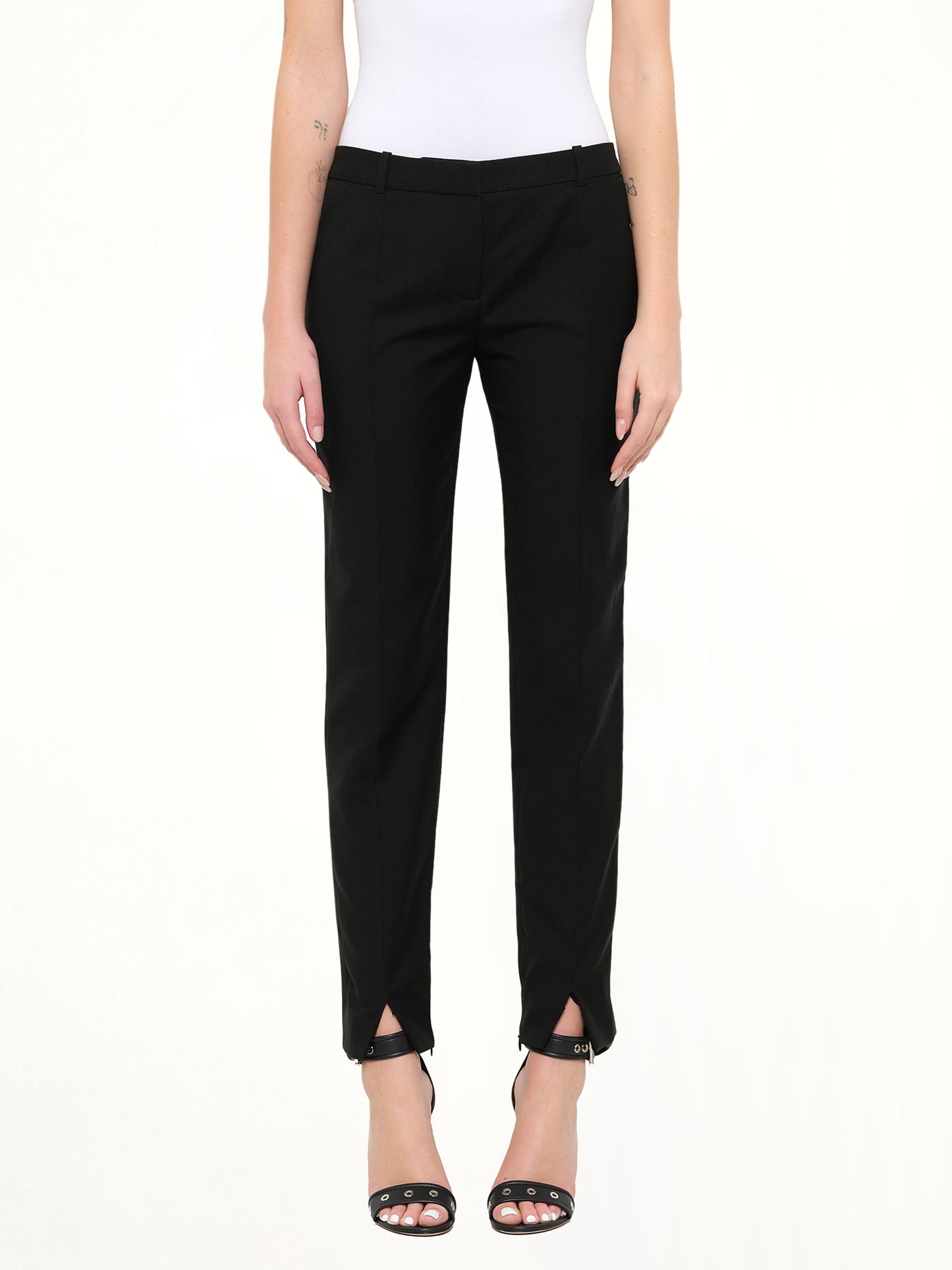 Image of a model wearing Pants. Product name - Pod Slim Fit Pants in Black colour by brand - GIVENCHY