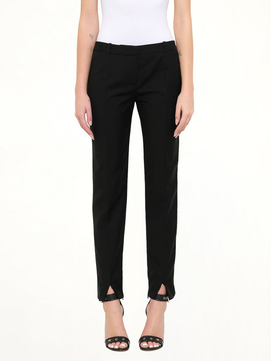 Image of a model wearing Pants. Product name - Pod Slim Fit Pants in Black colour by brand - GIVENCHY