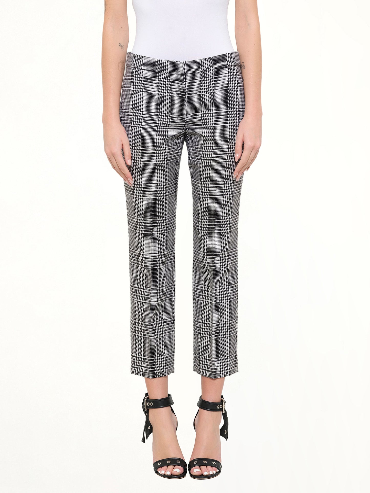 Image of a model wearing Pants. Product name - Prince Of Wales Pants in Black colour by brand - ALEXANDER MCQUEEN