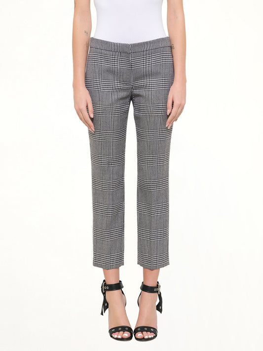 Image of a model wearing Pants. Product name - Prince Of Wales Pants in Black colour by brand - ALEXANDER MCQUEEN