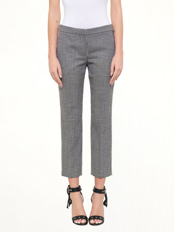 Image of a model wearing Pants. Product name - Prince Of Wales Pants in Black colour by brand - ALEXANDER MCQUEEN