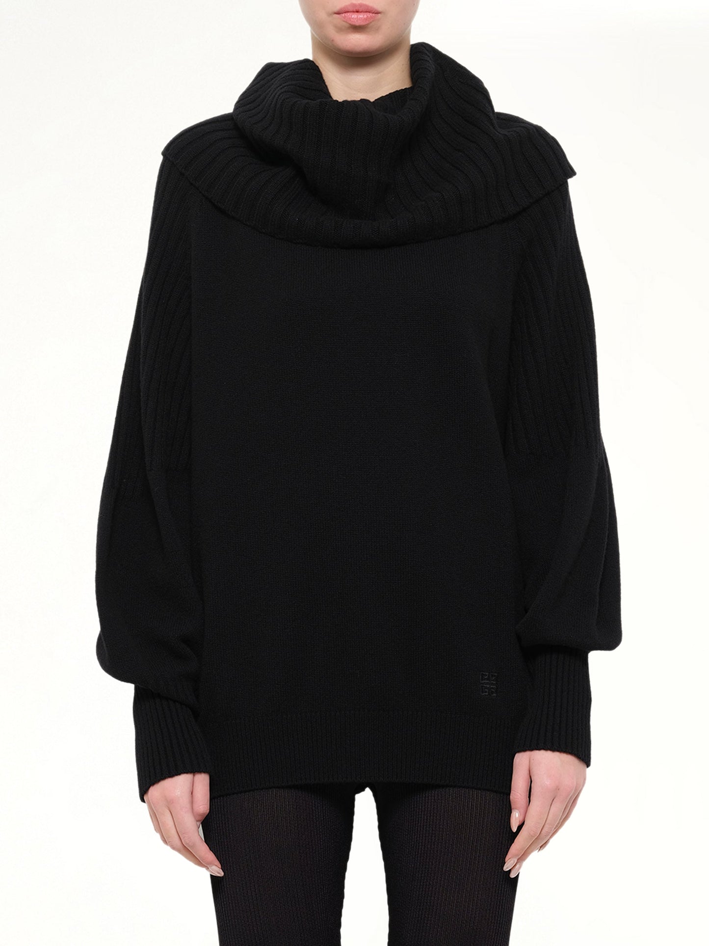 Image of a model wearing Outerwear. Product name - Pullover Sweater in Black colour by brand - GIVENCHY