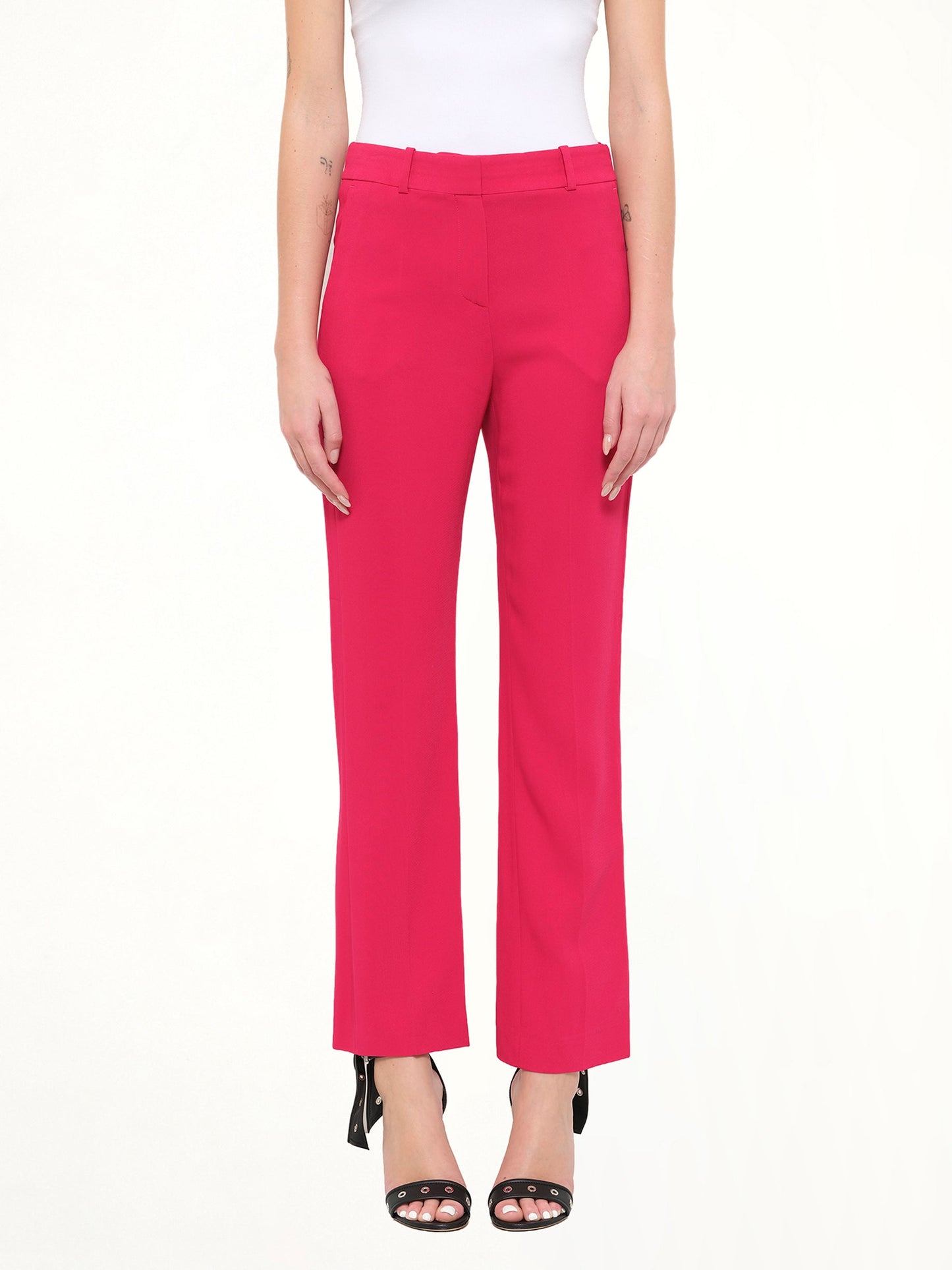 Image of a model wearing Pants. Product name - Regular Fit Pants in Fushia colour by brand - GIVENCHY