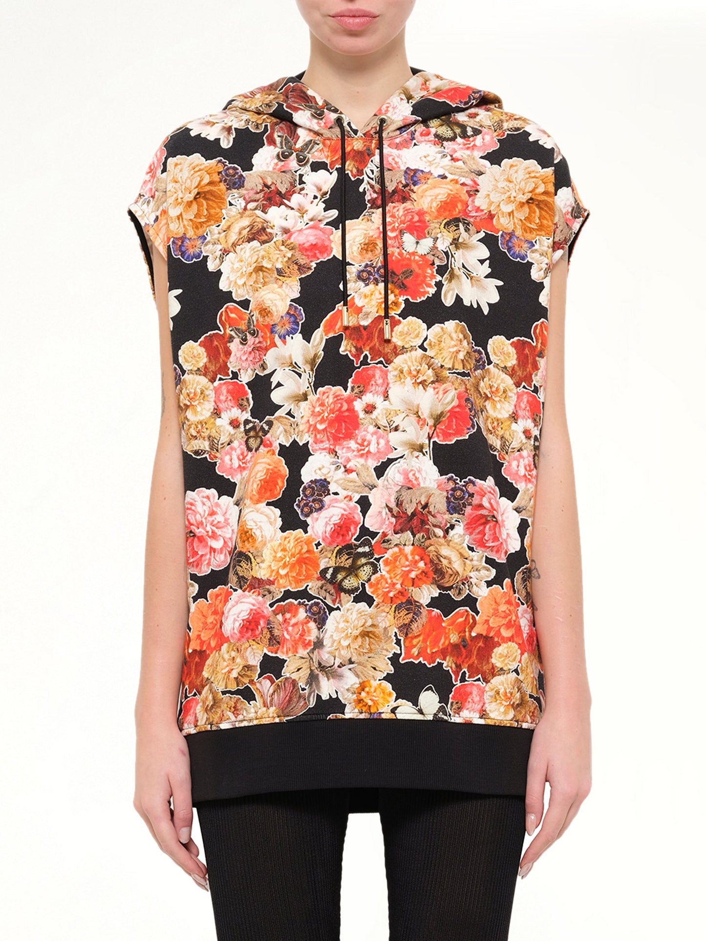 Image of a model wearing Outerwear. Product name - Short Sleeve Hoodie in Black colour by brand - GIVENCHY