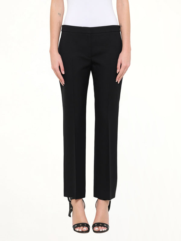 Image of a model wearing Pants. Product name - Wool Silk Pants in Black colour by brand - ALEXANDER MCQUEEN