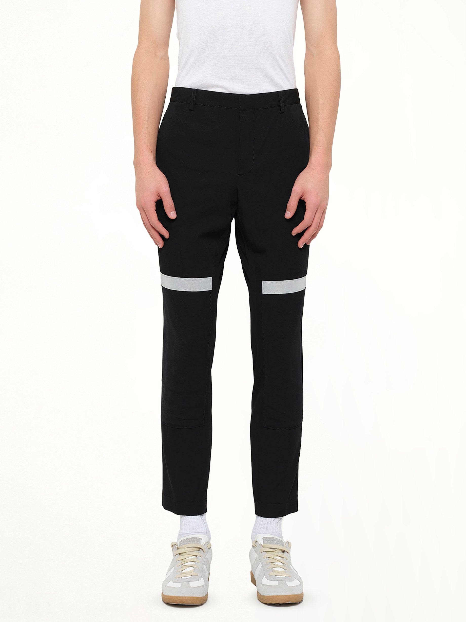 Image of a model wearing Pants. Product name - Lanvin Slim Crop Patch Trousers in Black colour by brand - LANVIN
