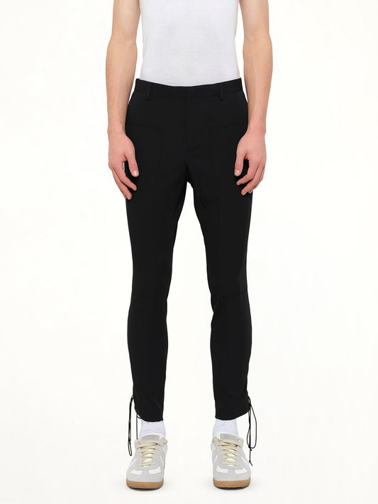 Image of a model wearing Pants. Product name - Lanvin Slim Crop Patch Trousers in Black colour by brand - LANVIN