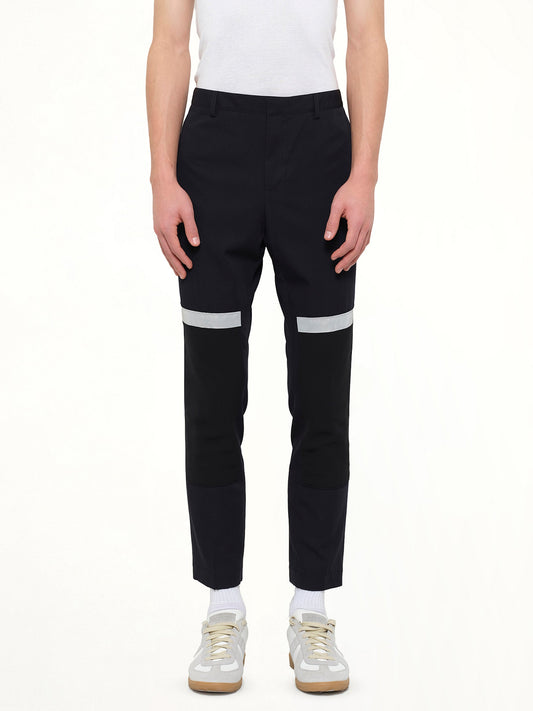 Image of a model wearing Pants. Product name - Slim Crop Patch in Blue colour by brand - LANVIN