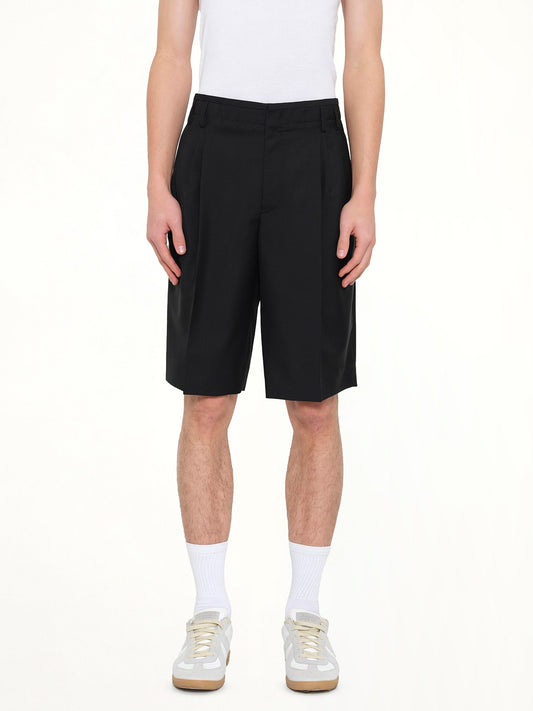 Image of a model wearing Shorts. Product name - Shorts in Black colour by brand - BALENCIAGA