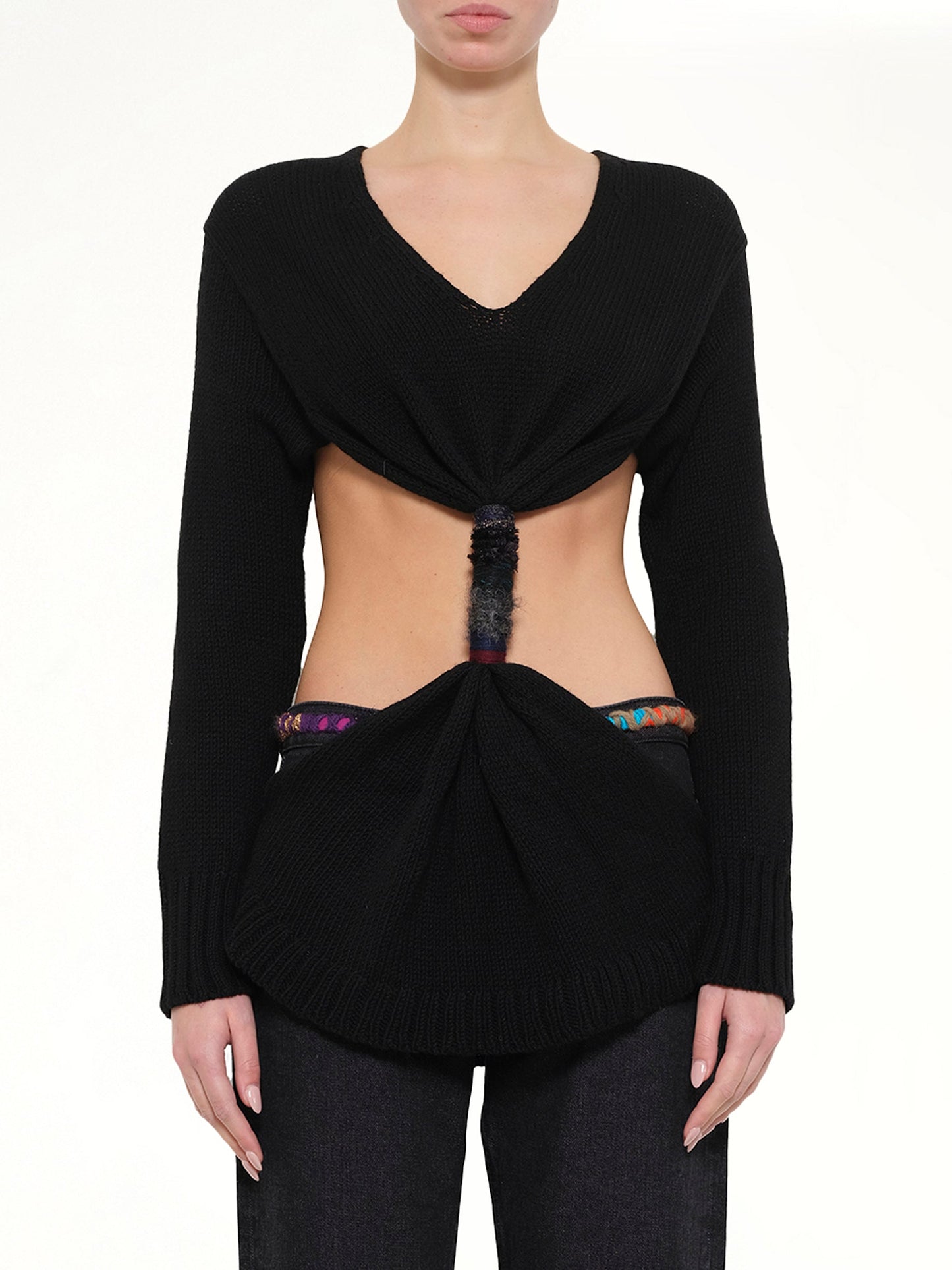 Image of a model wearing Outerwear. Product name - Embroidered Knot Sweatshirt in Black colour by brand - LOEWE