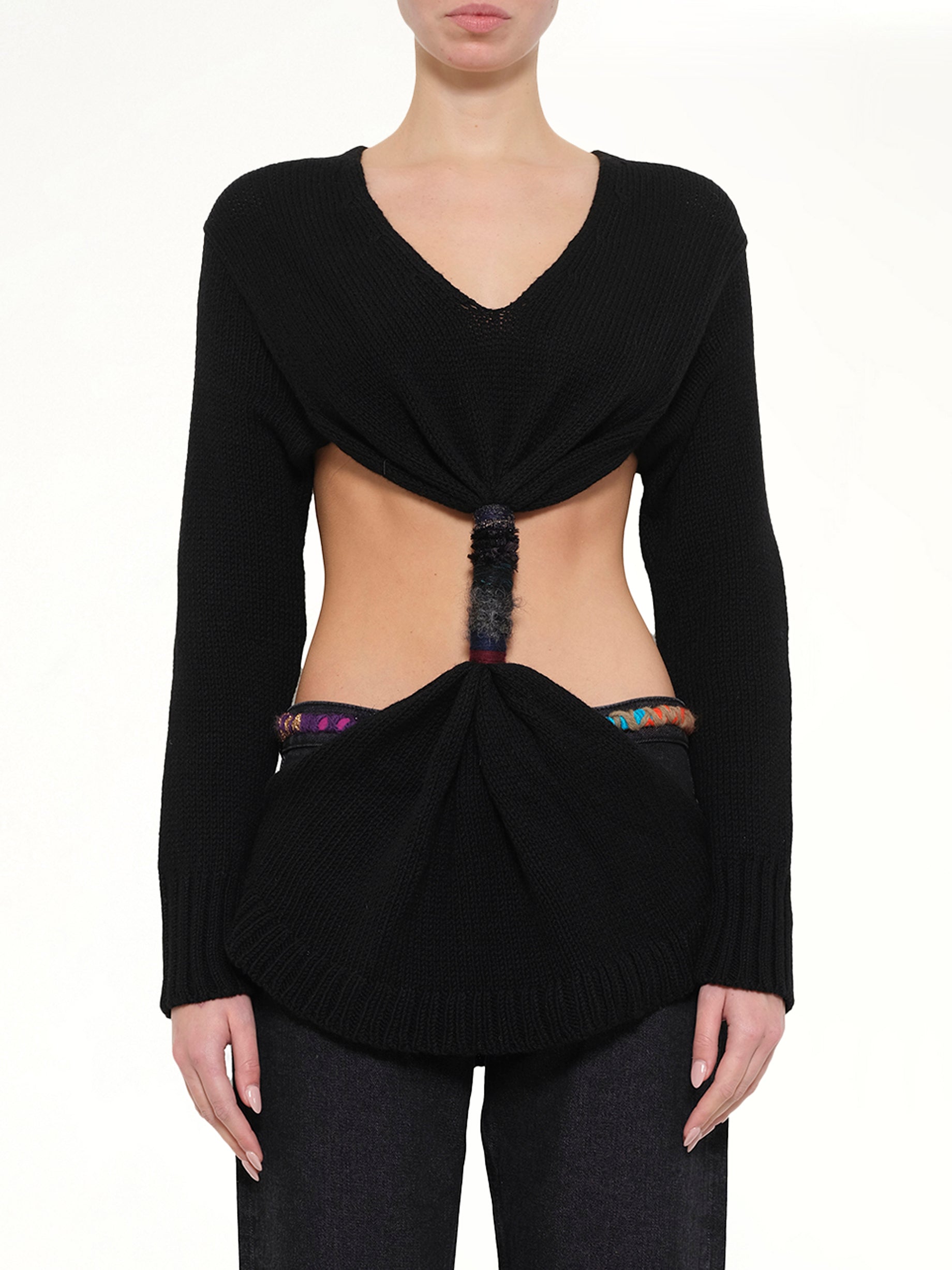 Image of a model wearing Outerwear. Product name - Embroidered Knot Sweatshirt in Black colour by brand - LOEWE