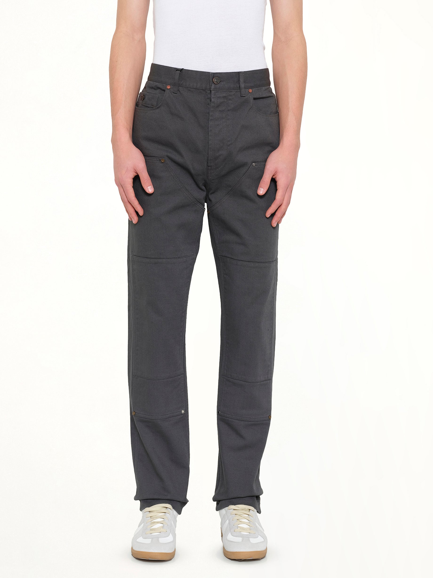 Image of a model wearing Pants. Product name - Patch Pants in Anthracite colour by brand - LANVIN