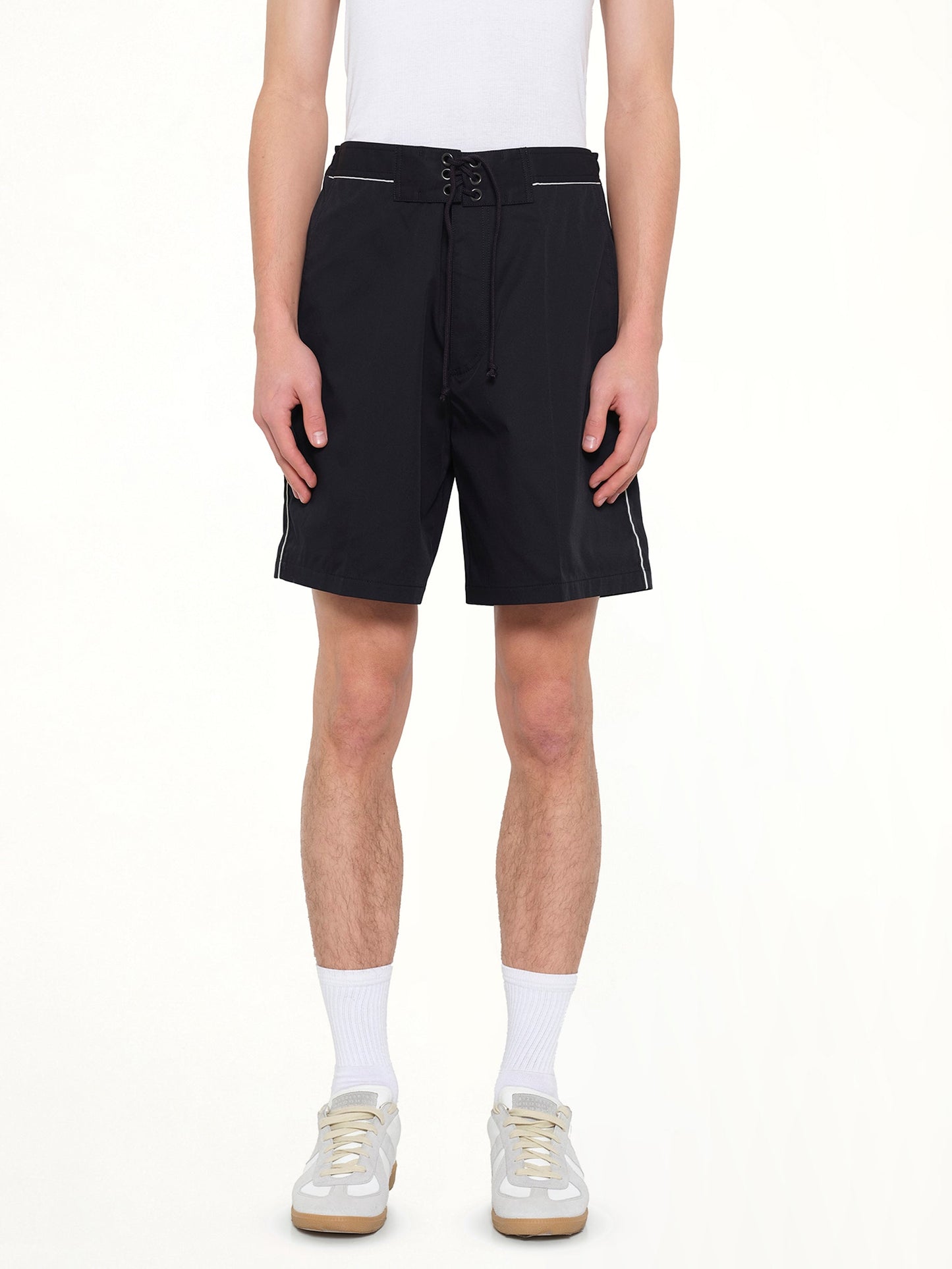 Image of a model wearing Shorts. Product name - Short Loose Belt in Navy colour by brand - LANVIN