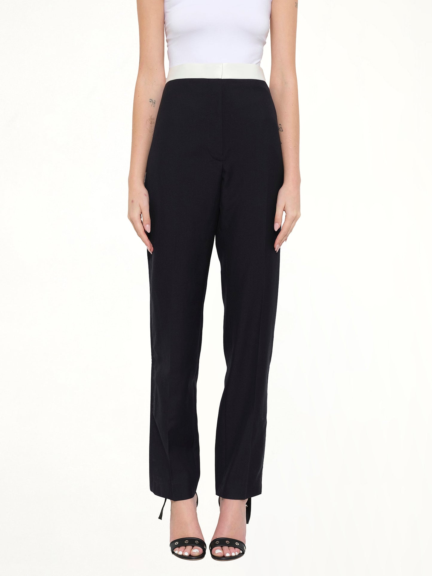 Image of a model wearing Pants. Product name - Tuxedo Trousers in Navy colour by brand - LOEWE