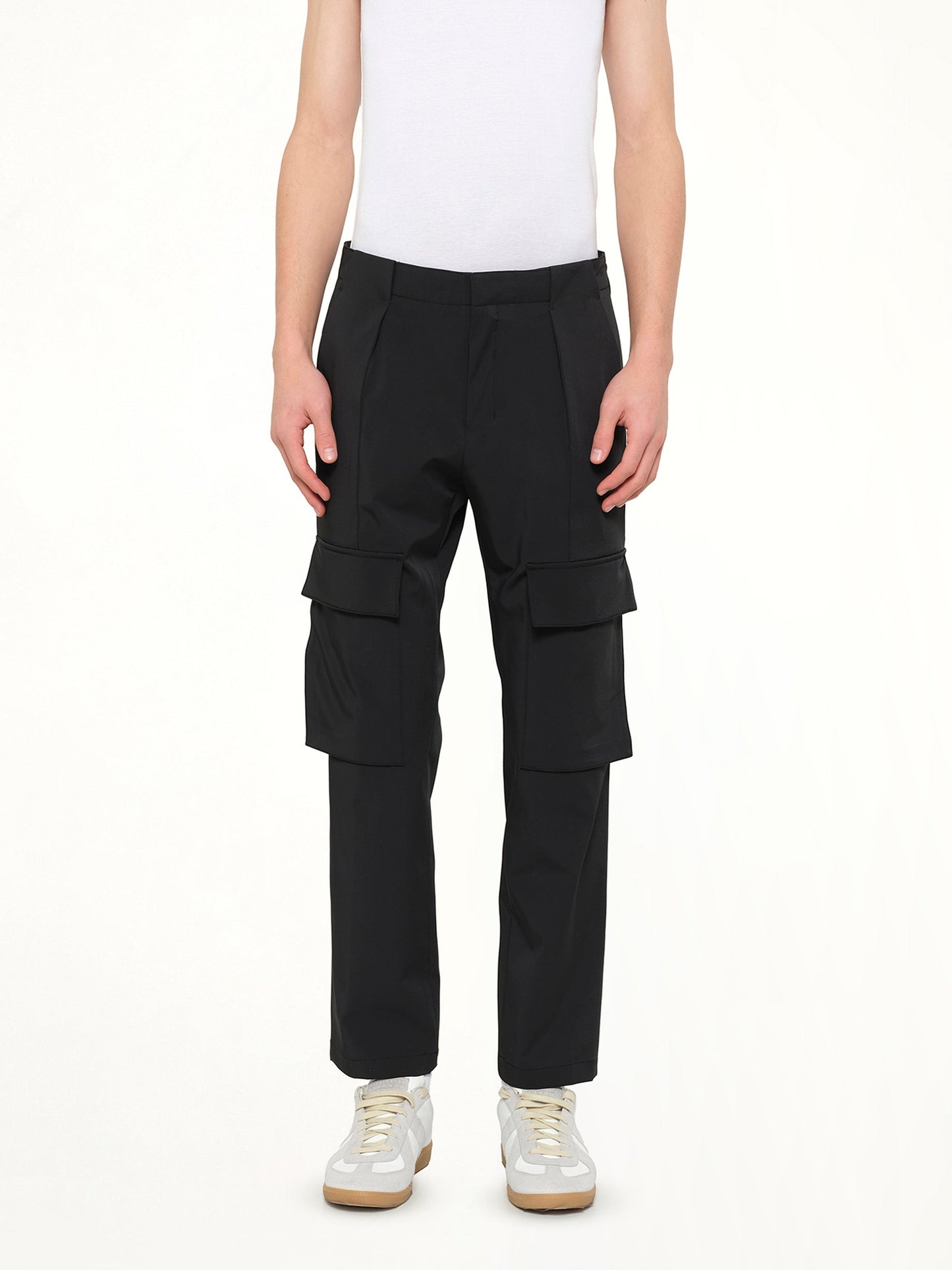 Image of a model wearing Pants. Product name - Casual Cargo Pants in Black colour by brand - WOOYOUNGMI