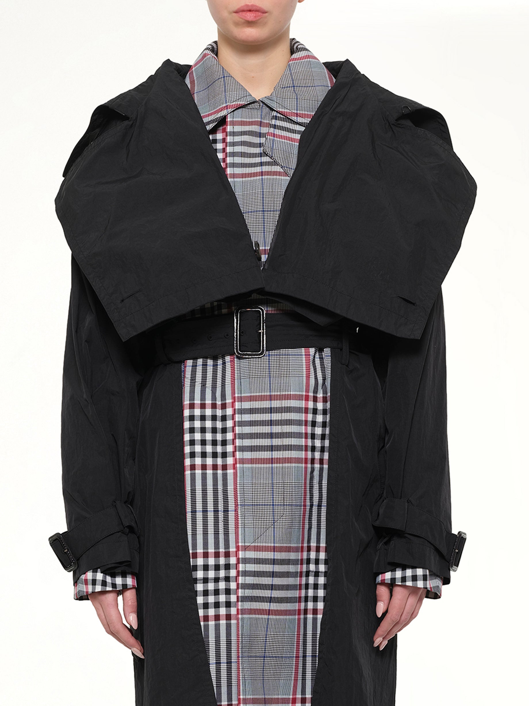 Image of a model wearing Outerwear. Product name - Coat in Black colour by brand - JUUNJ