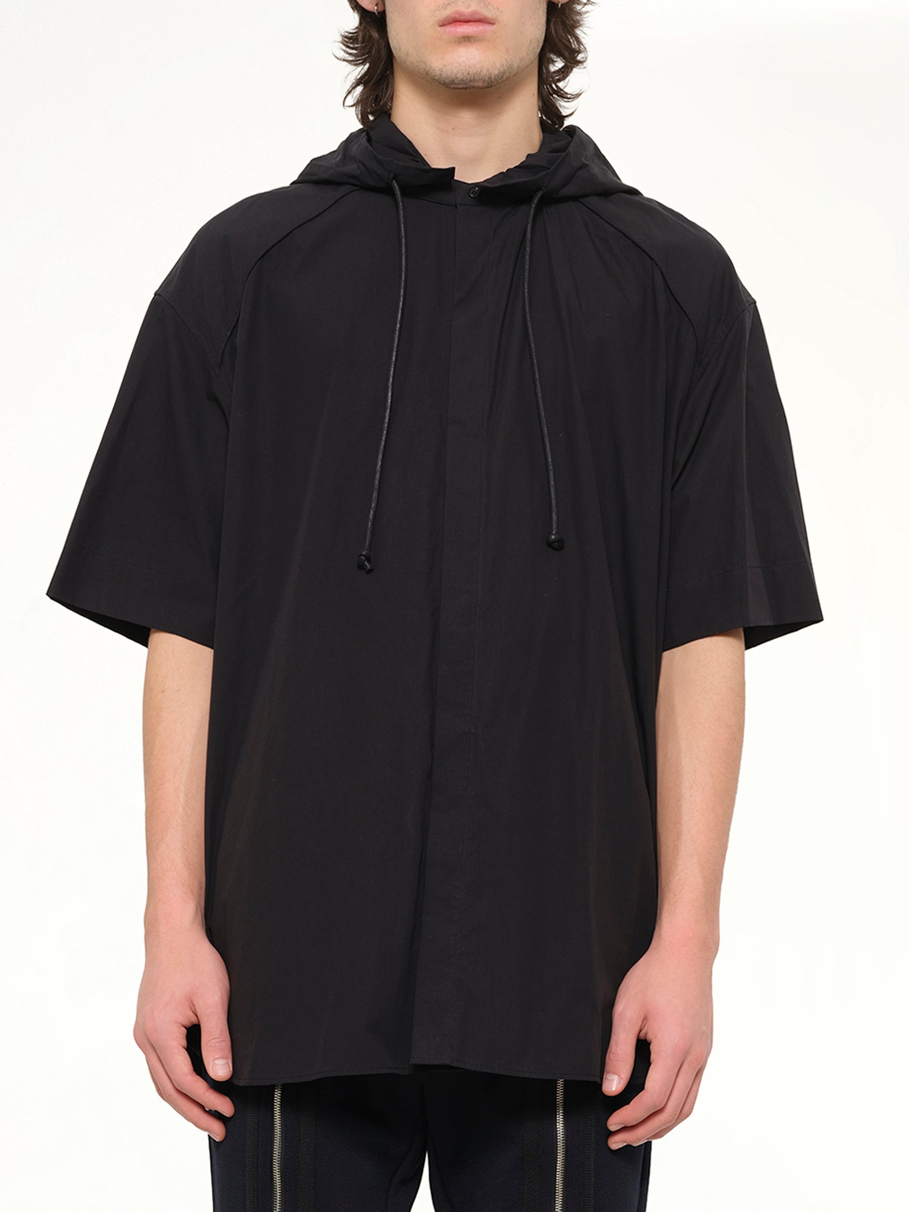 Image of a model wearing Outerwear. Product name - Juunj S/S Parka in Black colour by brand - JUUNJ