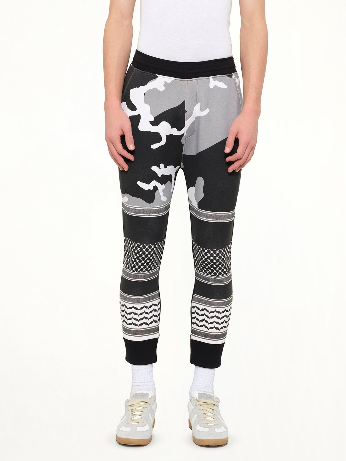 Image of a model wearing Pants. Product name - Neil Barrett Pants in Black colour by brand - NEIL BARRETT