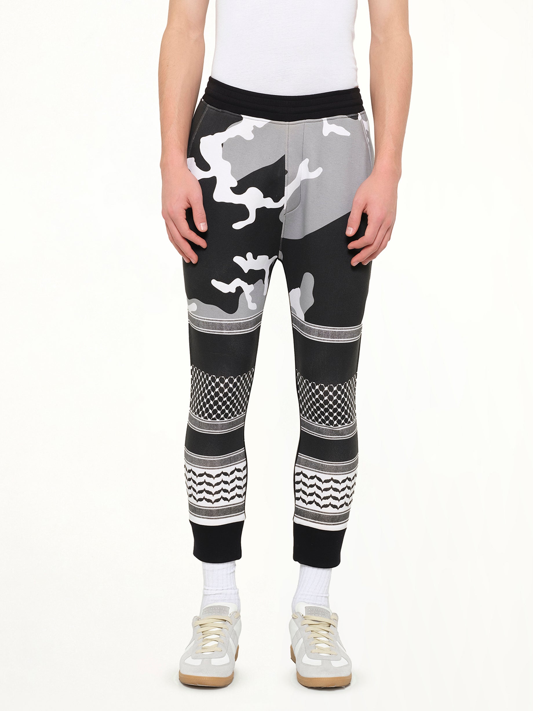 Image of a model wearing Pants. Product name - Neil Barrett Pants in Black colour by brand - NEIL BARRETT
