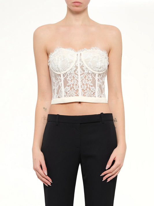 Image of a model wearing Tops. Product name - Alexander McQueen Bralette in White colour by brand - ALEXANDER MCQUEEN