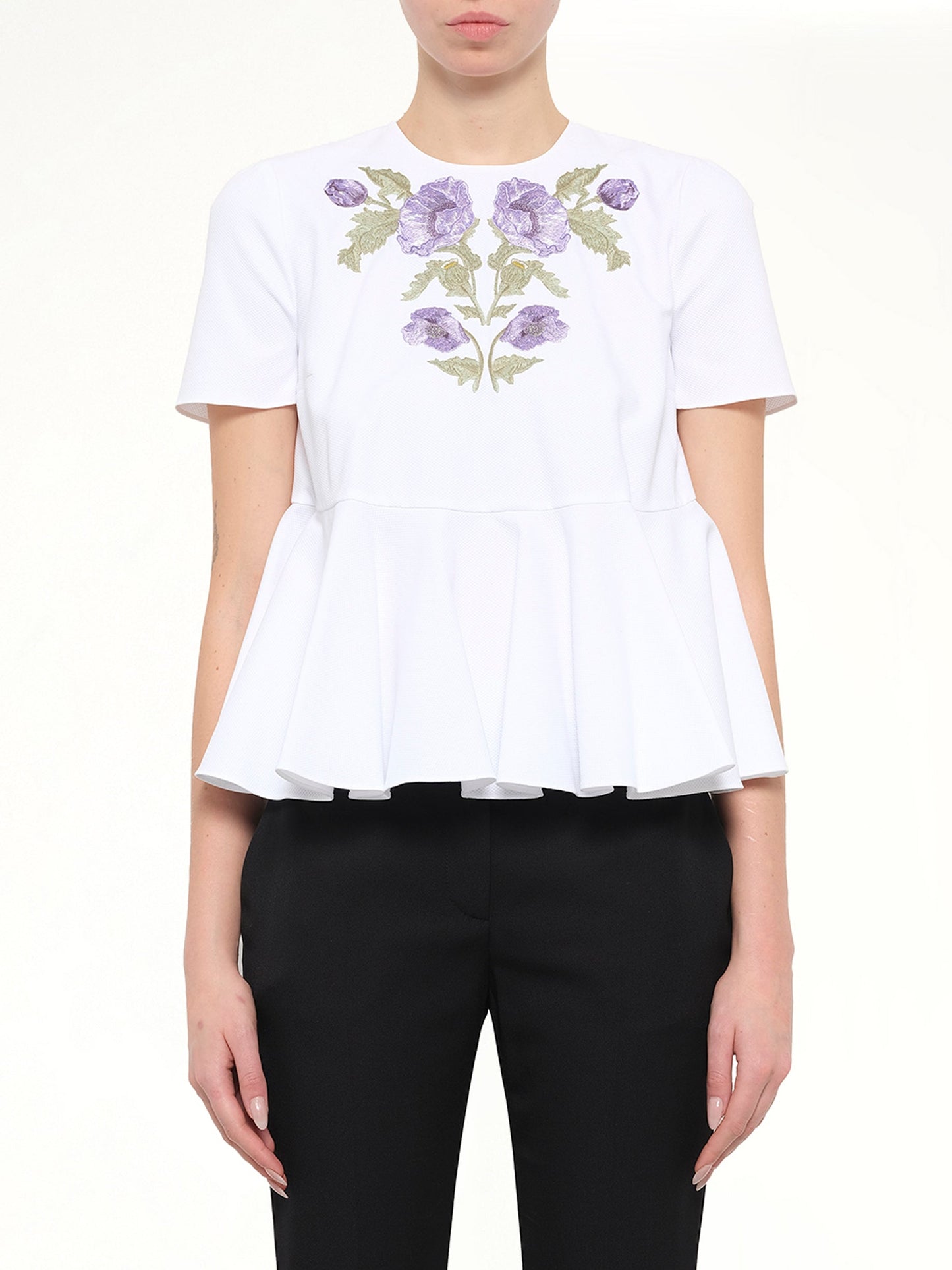 Image of a model wearing Tops. Product name - Alexander McQueen Cotton Piquet Top in 9000 colour by brand - ALEXANDER MCQUEEN