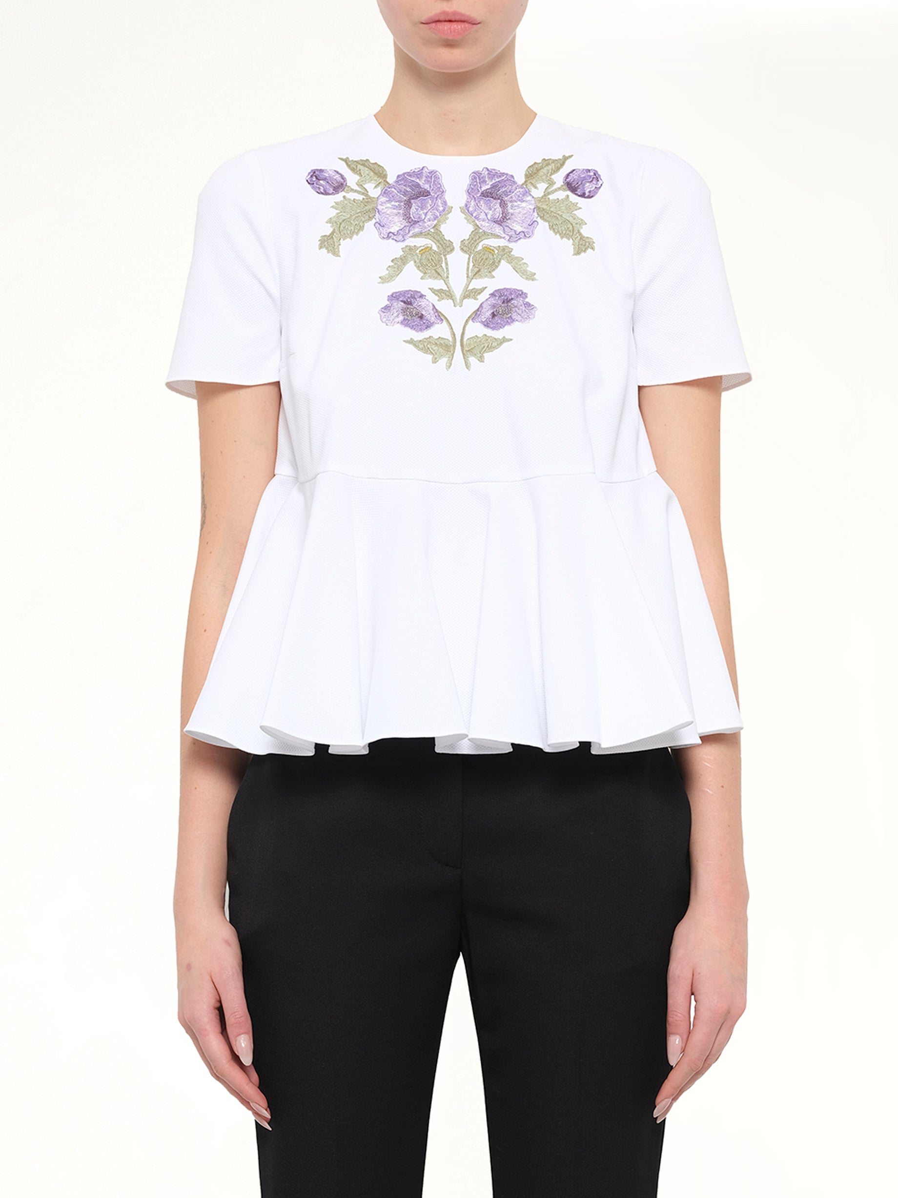 Image of a model wearing Tops. Product name - Alexander McQueen Cotton Piquet Top in 9000 colour by brand - ALEXANDER MCQUEEN