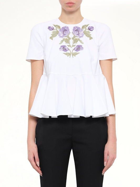 Image of a model wearing Tops. Product name - Alexander McQueen Cotton Piquet Top in 9000 colour by brand - ALEXANDER MCQUEEN