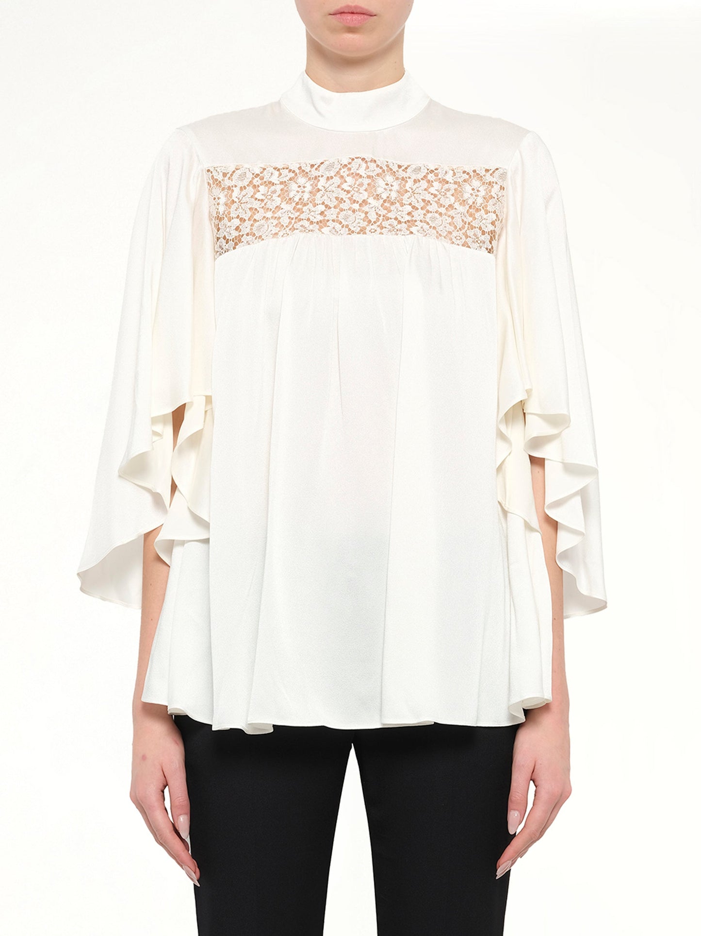 Image of a model wearing Tops. Product name - Alexander McQueen Fluid Satin Top in 9016 colour by brand - ALEXANDER MCQUEEN