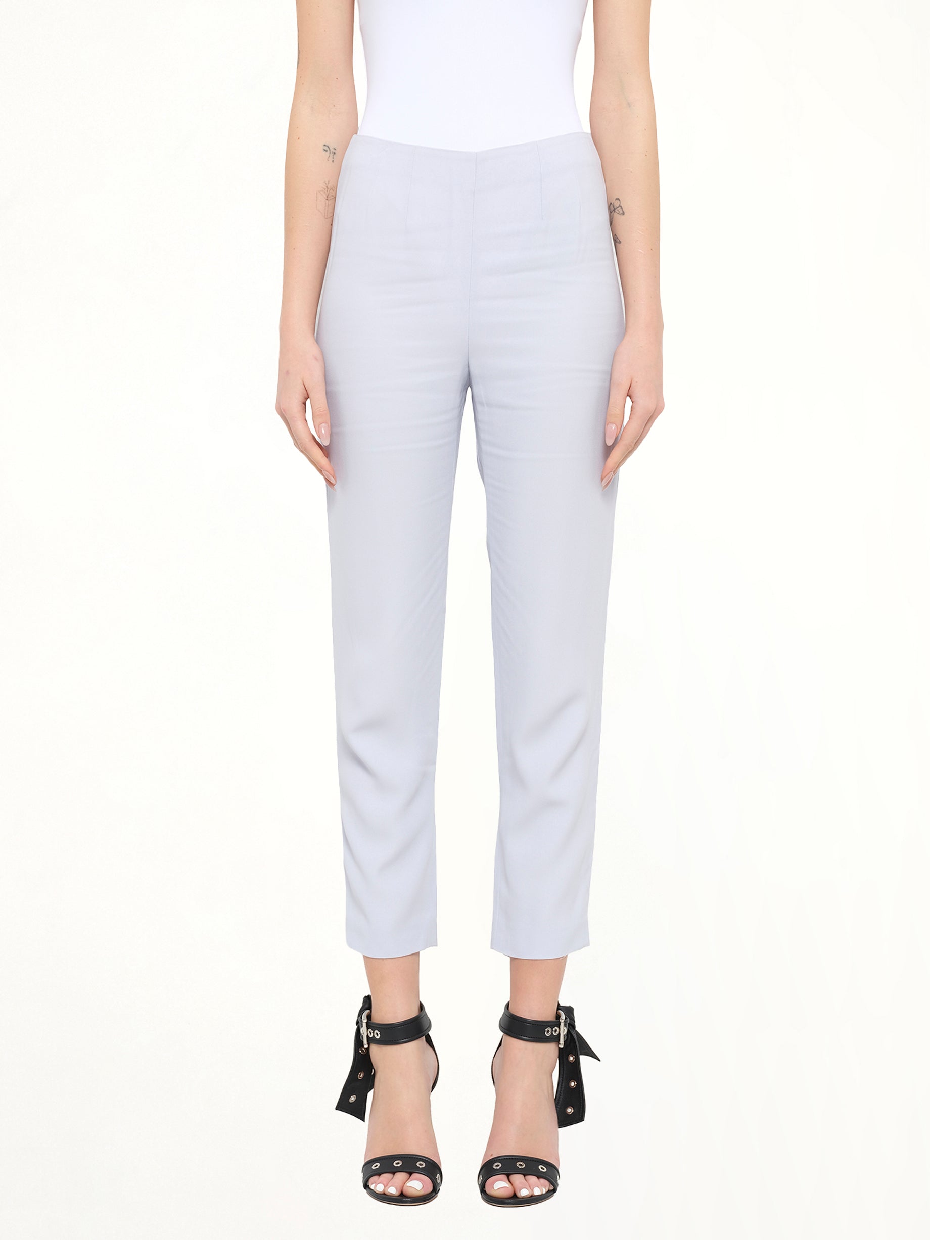 Image of a model wearing Pants. Product name - Alexander McQueen Pants in Blue colour by brand - ALEXANDER MCQUEEN