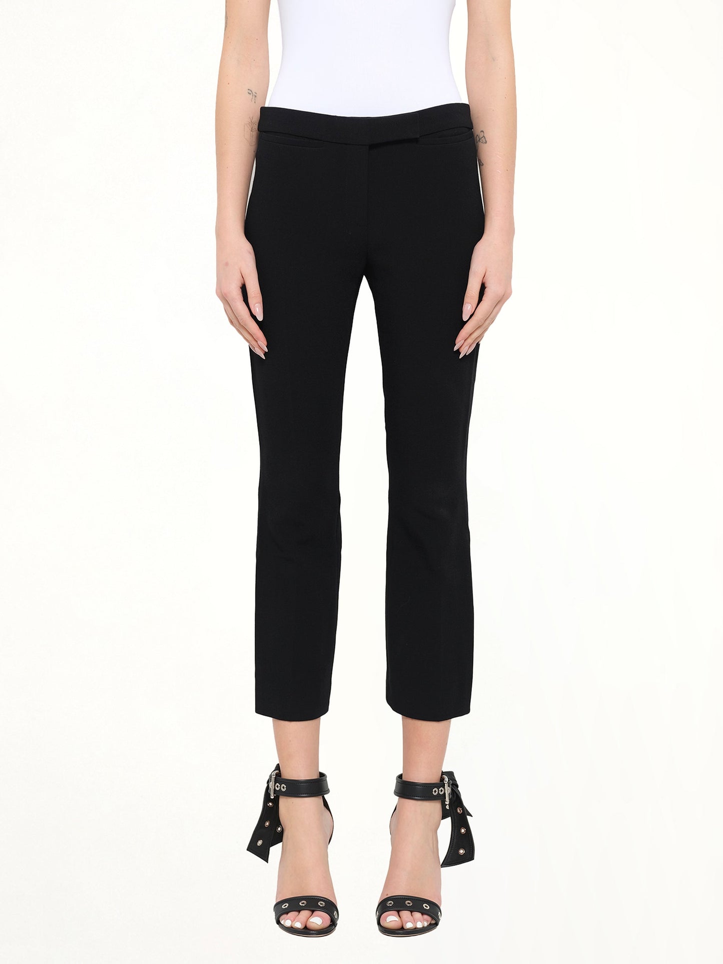 Image of a model wearing Pants. Product name - Alexander McQueen Wool Pants in Black colour by brand - ALEXANDER MCQUEEN