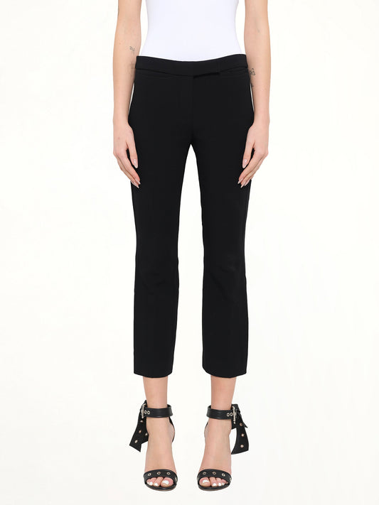 Image of a model wearing Pants. Product name - Alexander McQueen Wool Pants in Black colour by brand - ALEXANDER MCQUEEN