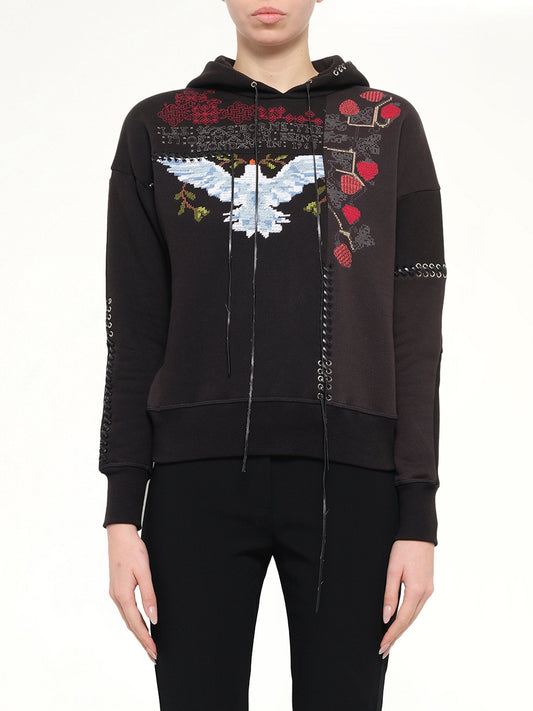 Image of a model wearing Outerwear. Product name - Bird Embroidered Hoodie in Black colour by brand - ALEXANDER MCQUEEN