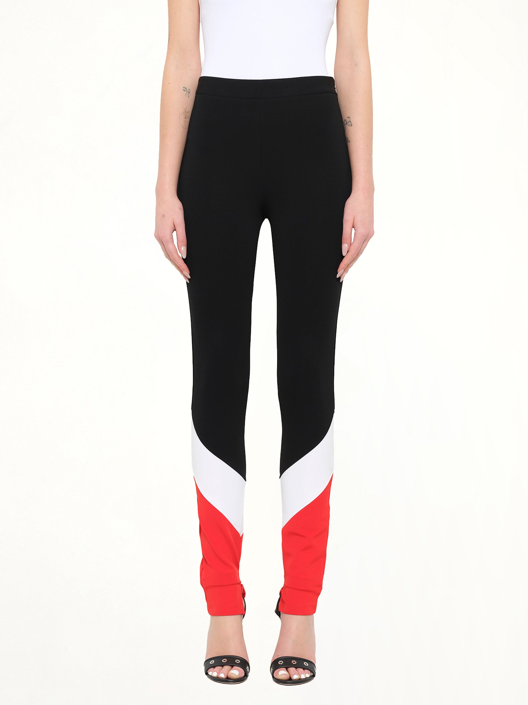 Image of a model wearing Pants. Product name - Givenchy Leggings in Black colour by brand - GIVENCHY
