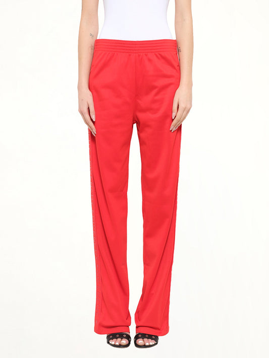 Image of a model wearing Pants. Product name - Givenchy Podium Trousers in Red colour by brand - GIVENCHY